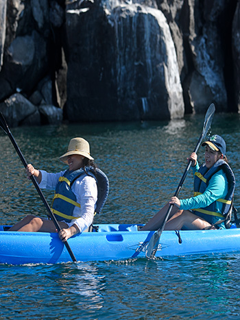 enjoying the sport kayaking near the coast Elite Catamaran cruise to Galapagos