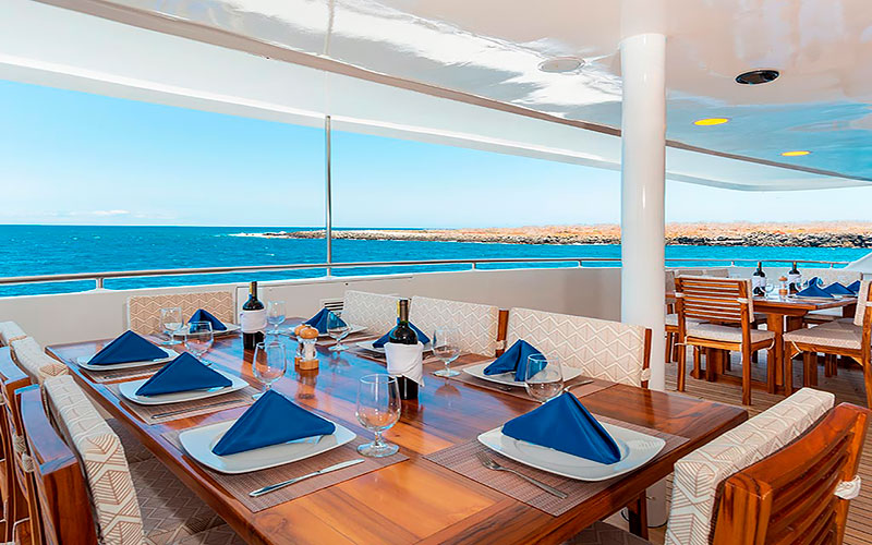 Al fresco dinning room with ocean view for guests Galapagos catamaran