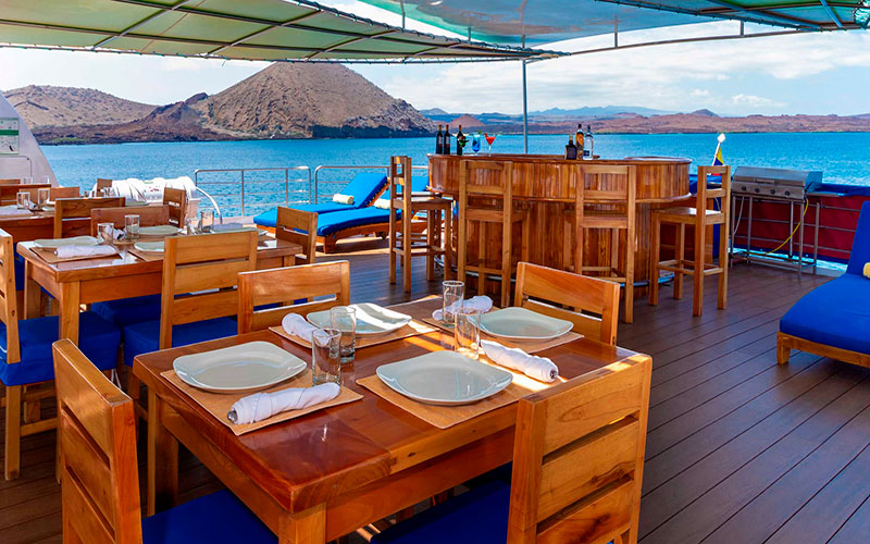 Outdoor dining on terrace petrel luxury catamaran cruise to Galapagos