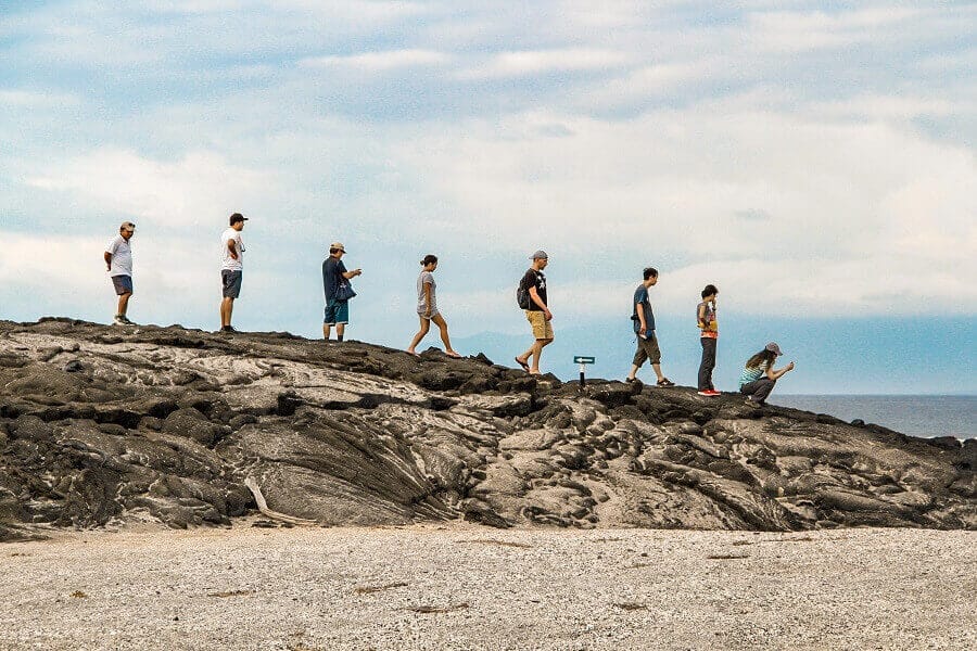 People walk keeping the distance in Galapagos