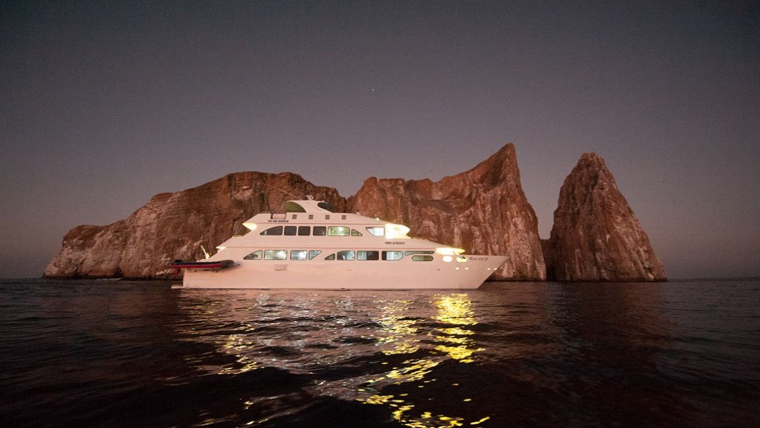 cruise ship in Galapagos at night
