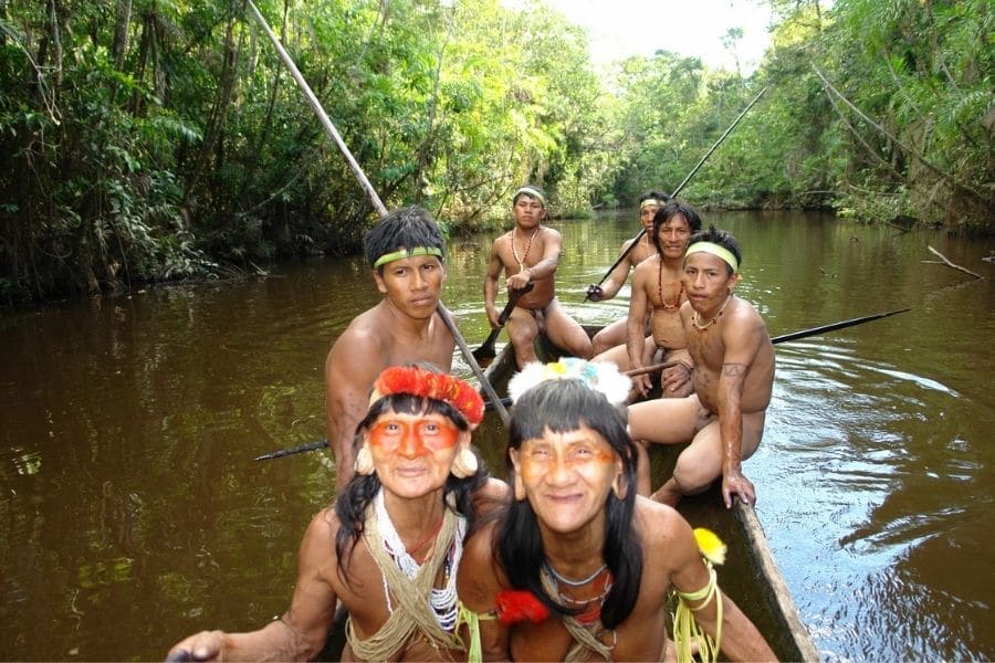 Waoranis sailing in the Ecuadorian Amazon jungle